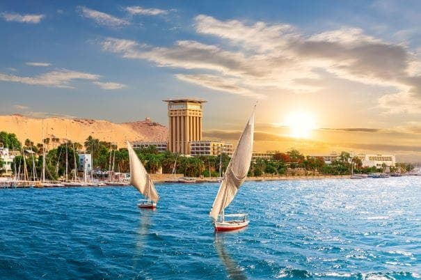 aswan-sunset-scenery-view-nile-traditional-boats-egypt